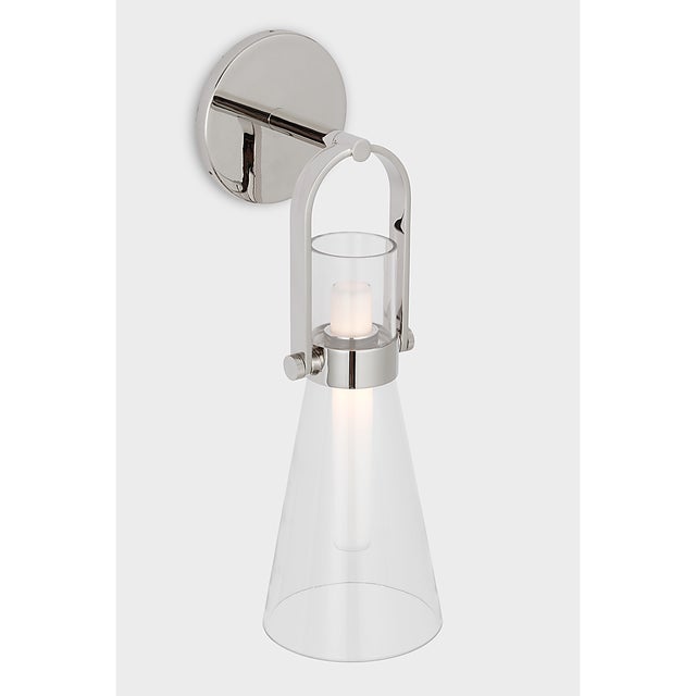 Larkin Medium Conical Bracketed Sconce in Polished Nickel with Clear Glass Designer: Ian K. Fowler Finish: Polished Nickel...