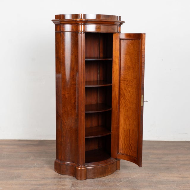 19th century Danish column cabinet, with beautiful mahogany veneer throughout. The front is detailed with a convex paneled...