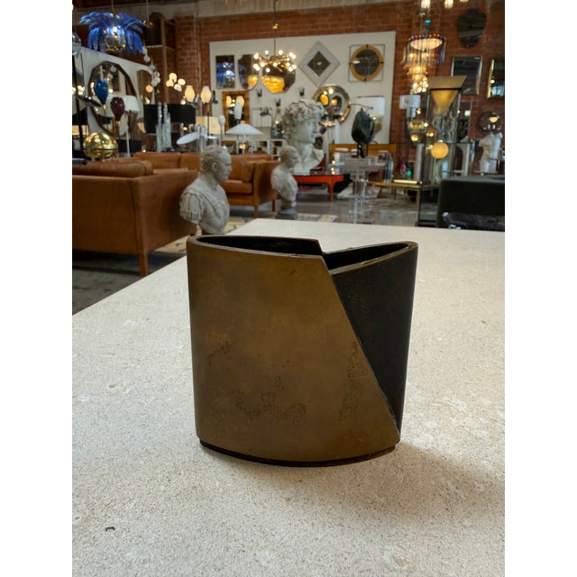 Architectural and bold in its geometry, this sculptural vase by Esa Fedrigolli exemplifies the refined craftsmanship and...