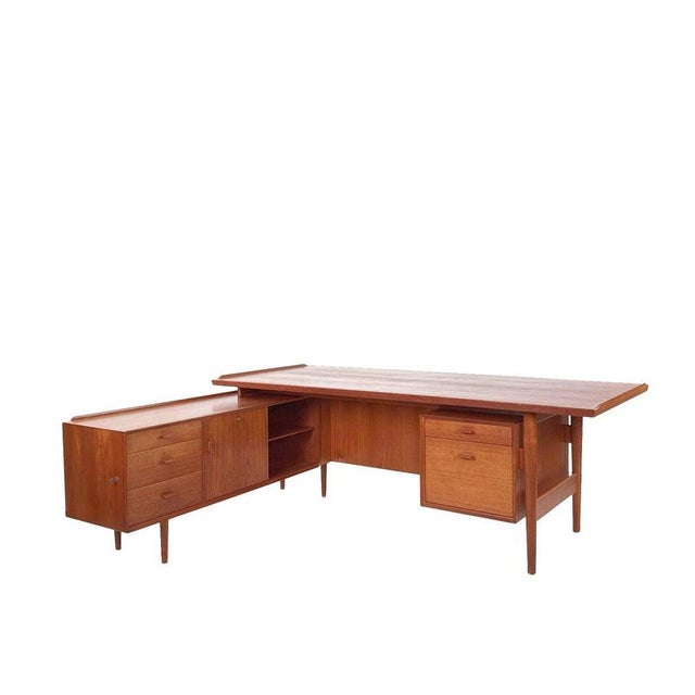 A masterpiece of Danish design: this Arne Vodder desk, Model 209, was designed for Sibast in the early 1960s and is a rare...