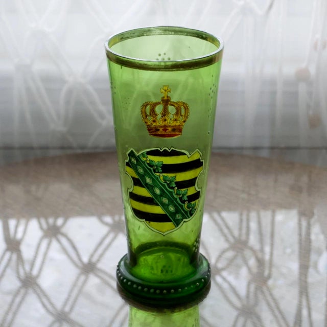Antique Bohemian green glass vessel featuring a finely detailed heraldic coat of arms design referencing Saxony 1593....