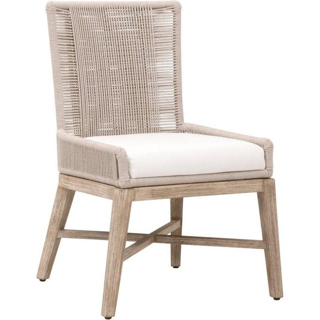 The Overlay Dining Chair, crafted by Essentials For Living, brings a touch of elegance to any dining area. This chair set...