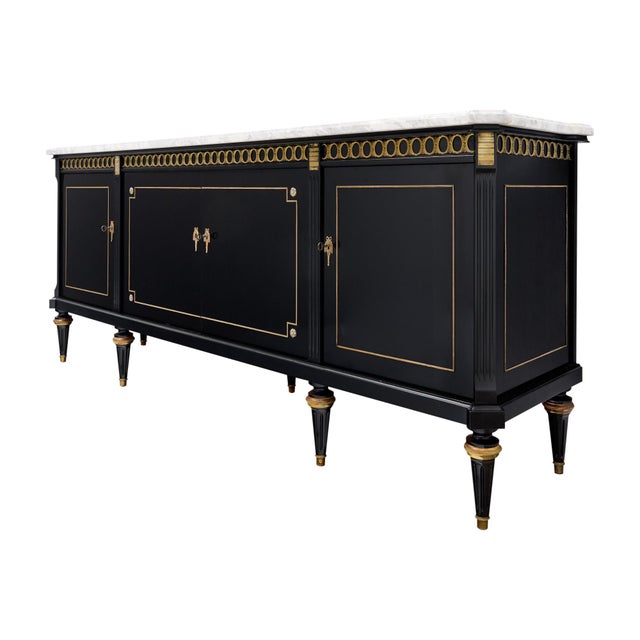 Buffet from France in the Louis XVI style. This enfilade is made of solid wood construction, primarily mahogany. It has...