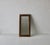 A decorative rectangular metal wall mirror with an ornate, chunky, double-beaded gold/brass antiqued distressed finish....