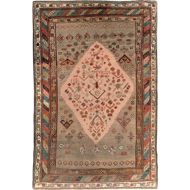 An early 20th-century Persian Kurd Tribal accent size rug. Measures: 5' x 7'7'.