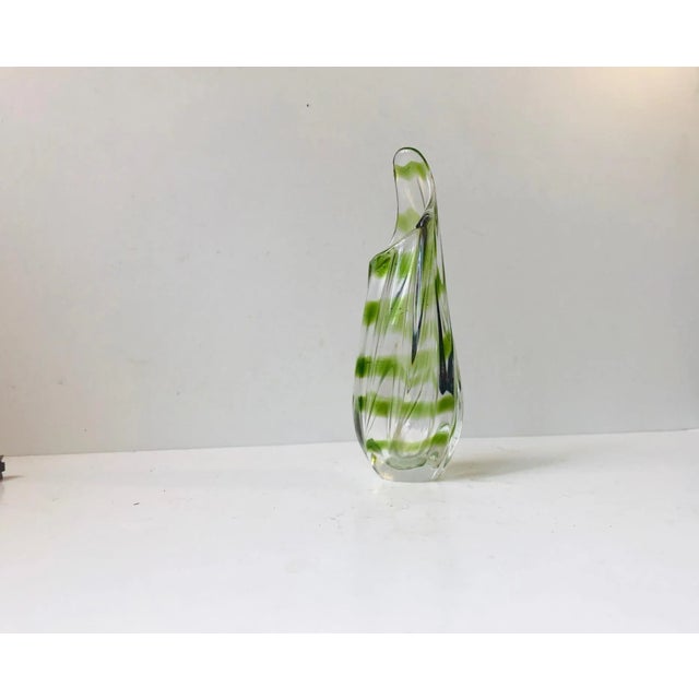 - Biomorphic shaped vase is clear hand blown glass - Applied green stripe - Designed and manufactured by Seguso in Murano,...