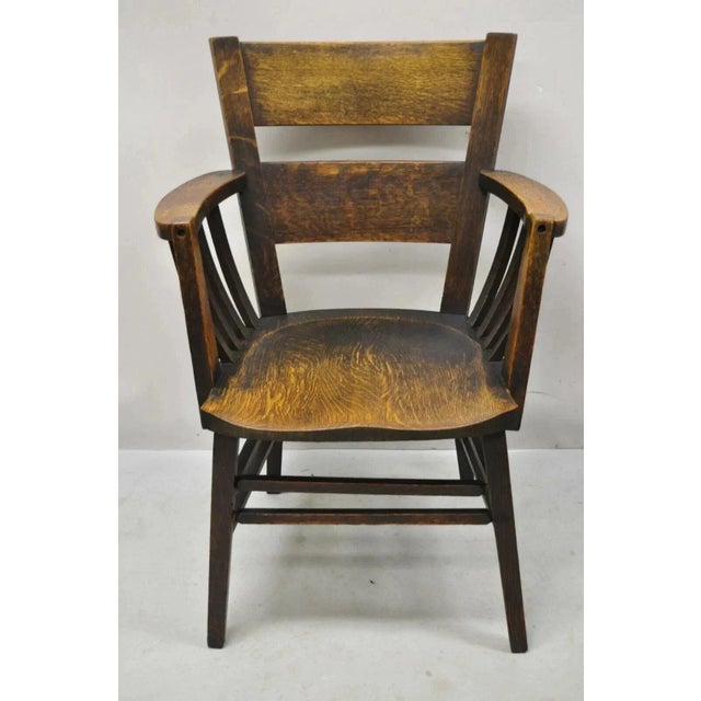 Antique Arts & Crafts Mission Oak Bowed Spindle Plank Seat School Arm Chair. Circa Early 20th Century. Measurements: 37" H...