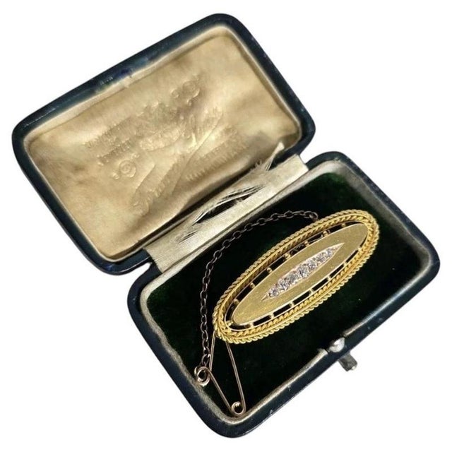 A fine Victorian 15ct yellow gold oval brooch dating to circa 1890, displaying the richly detailed character associated...