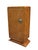 A pair of Art Deco tall cabinets. Amboyna with patinated bronze and glass details. Each cabinet shelved with a single...