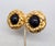 1980s round goldtone textured with cabochon faux-onyx center clip earrings. Marked "ESCADA©" on a cartouche on the back of...