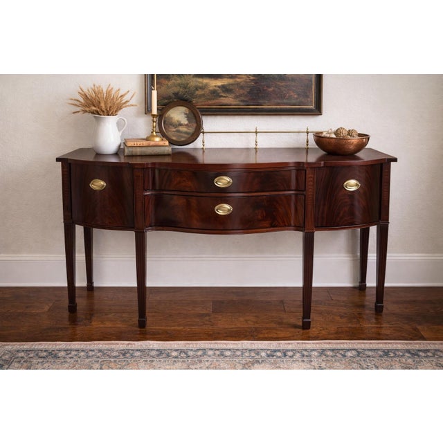 Description: Elevate your space with this stunning vintage Thomasville mahogany sideboard, crafted with timeless elegance...