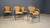 Vintage wrought iron and wicker bistro/dining chairs attributed Frederick Weinberg. Elegant black wrought frame with a...