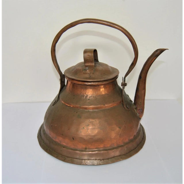 This is an antique (cc 1860s) stove kettle or bathroom water pitcher (see photos) which is hand-hammered and hand-...
