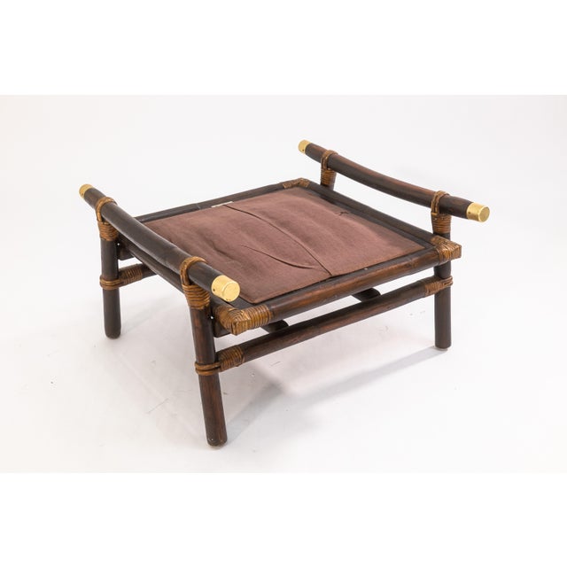 A pair of John Wisner for Ficks Reed ottoman footstools. This is a wonderful vintage 1950s pair of footstools by Ficks...