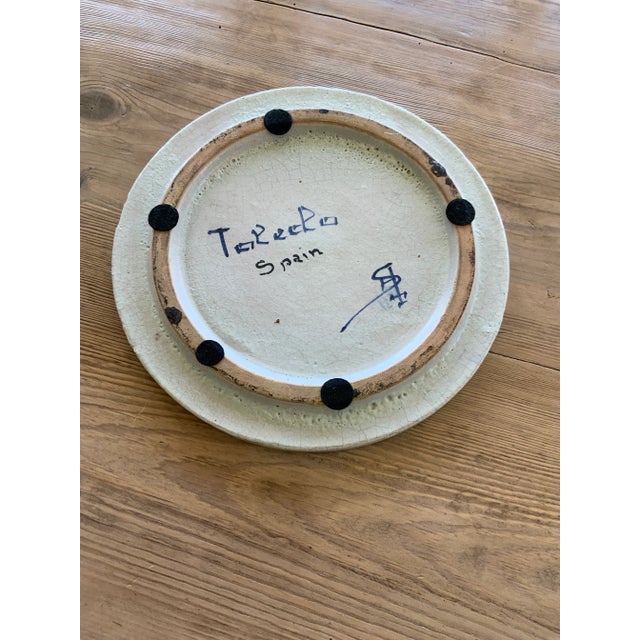 Beautiful and heavy, this mid-size polychrome serving platter/trivet/wall plate features a recurring French blue...