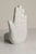 Left-handed bookend or decorative piece from the 1980s, made of white ceramic. It is clean and undamaged.