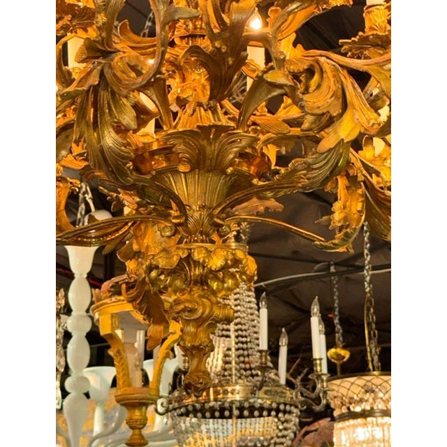This 19th c. French Gilt Bronze Chandelier is a luxurious and elegant lighting fixture perfect for any indoor space. The...
