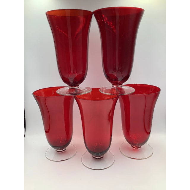An elegant set of 5 vintage red Crystal fluted top water/wine goblets glasses. They make a beautiful ping sound. They...