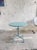 This elegant and rare garden table, designed by Swiss architect and designer Max Ernst Haefeli and produced by Embru Werke...
