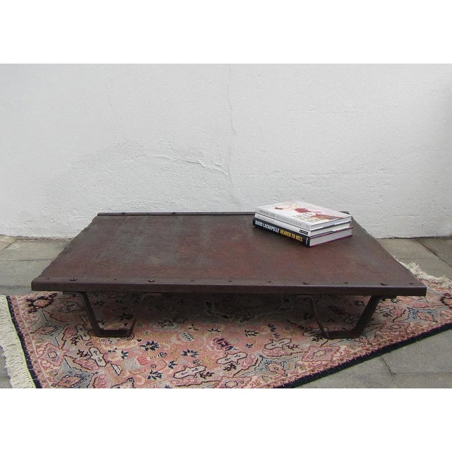 Low coffee table which was originally used as an industrial palette in a Belgian factory in the 1950s. The robust table...