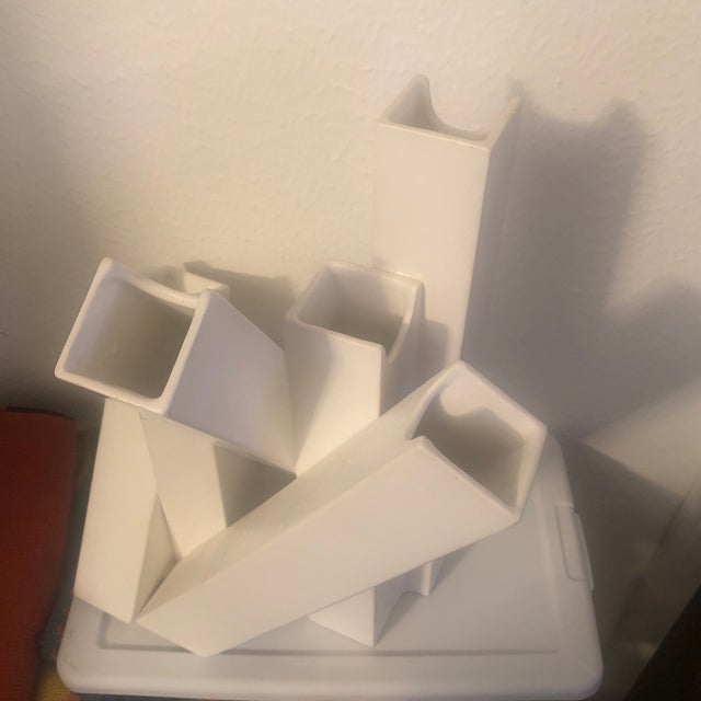 Contemporary ceramic vase with matte finish Multiple openings for a creative design In the style of David Brown Made in China