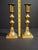 A fine pair of antique English brass candlesticks featuring multi-knop stems and square stepped bases with clipped...