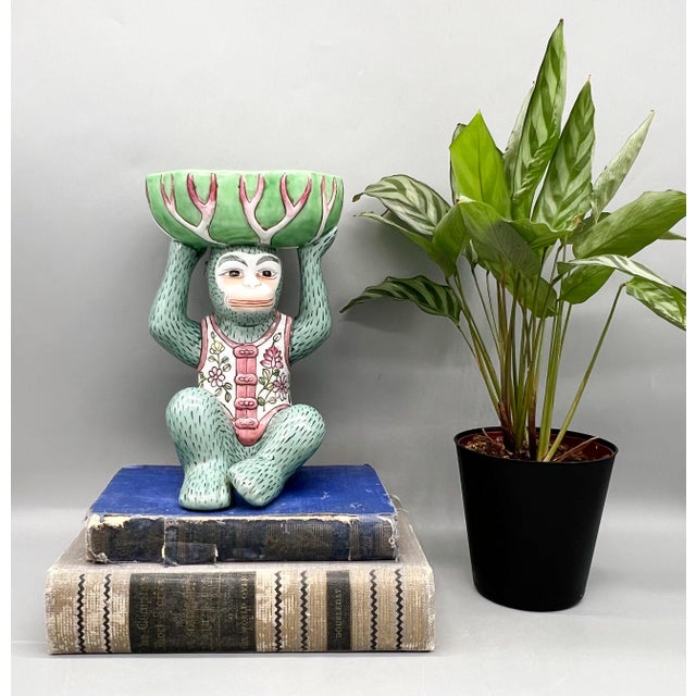 Vintage Andrea by Sadek ceramic monkey figurine featuring a seated monkey holding a decorative bok choy bowl overhead....