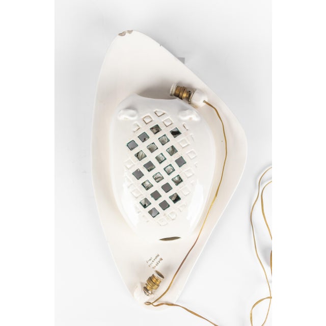 Wall sconce in italian ceramic. Created by Luigi Carron (1926-2006) Manufactured by Alcyone Good condition: 2 chips on the...