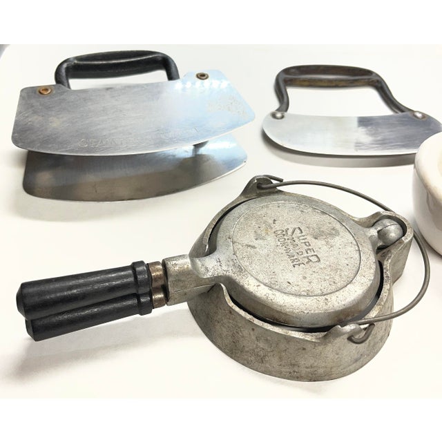 Ceramic mortar and pestle. Tiny functioning waffle iron. Two steel choppers.