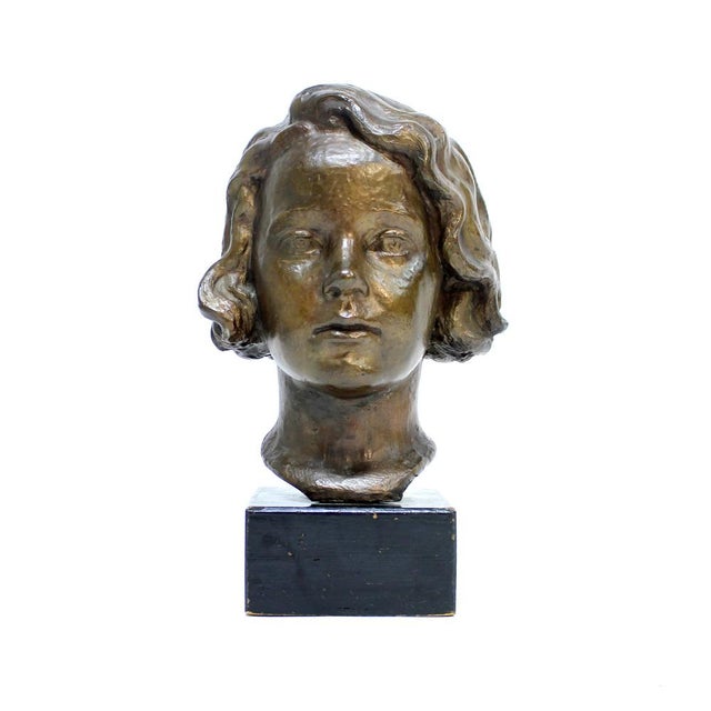 High quality bronze sculpture bust of a girl made of bronze on a black painted wooden socket, signed J.G by an...