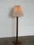 A Danish oak brutalist floor lamp, 1960s–1970s. The stem is a square-section oak column carved with repeating recessed...