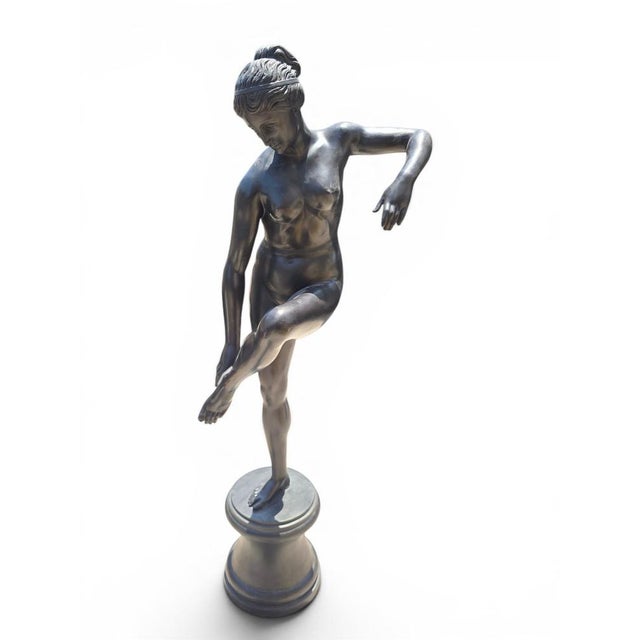 Elegant and monumental bronze sculpture depicting Aphrodite, known to the Romans as Venus, inspired by the celebrated...