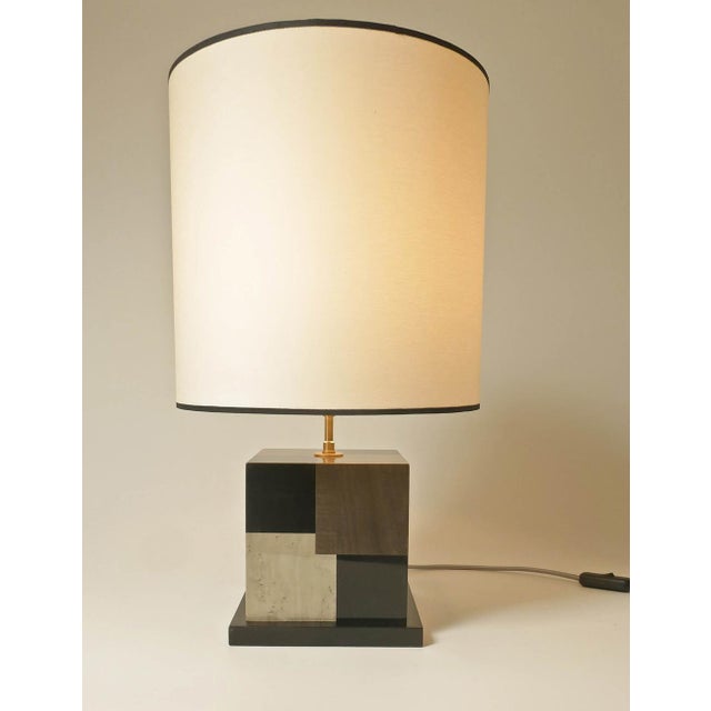 Table lamp in sycamore marquetry, stained black, light gray, and dark gray. Carefully crafted in our Parisian workshop,...