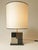 Table lamp in sycamore marquetry, stained black, light gray, and dark gray. Carefully crafted in our Parisian workshop,...
