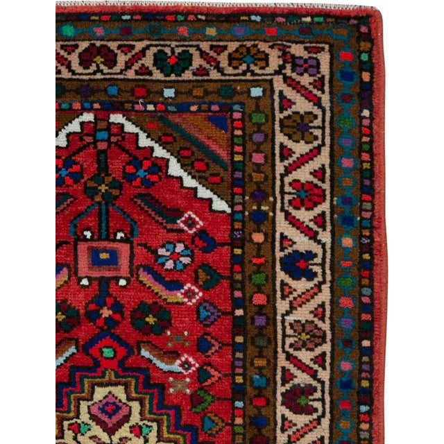 A vintage Persian hamadan rug from the mid-20th century. Hamadan town and the surrounding weaving area of about 120...