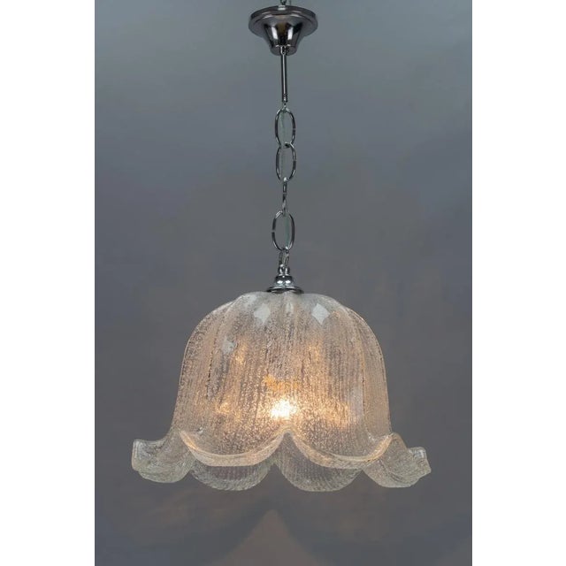 - An elegant Mid-Century Modern pendant light fixture; - beautifully shaped ice glass shade and chrome-plated metal...