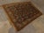 Antique Persian rug displaying Geometric motifs. Wool pile on wool foundation. 5'5"x 7'7"