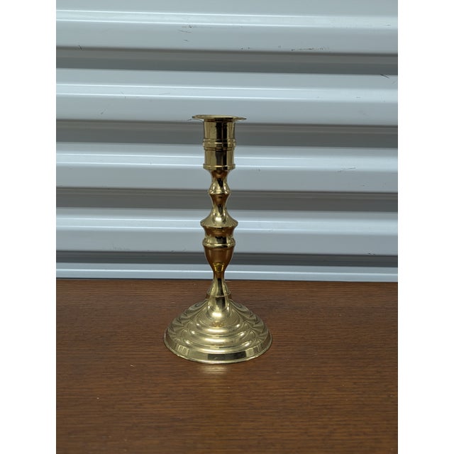 Elevate your mantel or dining landscape with this stunning set of four vintage solid brass candlestick holders,...