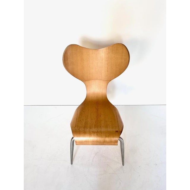 Chaise Empty Ron Arad pour Driade, 1993 aluminum, molded plywood Dimensions : L52cm P60cm H92cm H seat 45cm This piece has...