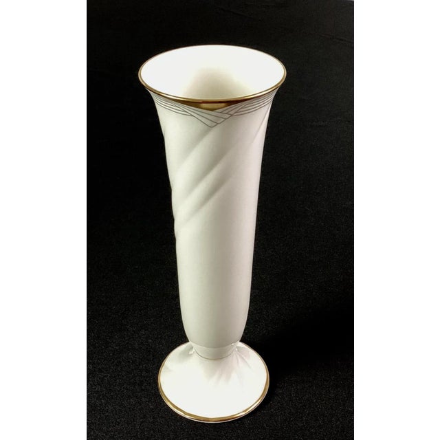 Noritake-“ Golden Cove”-Art Deco cream colored porcelain with gold trim vase The porcelain swerves upward to the rim and...