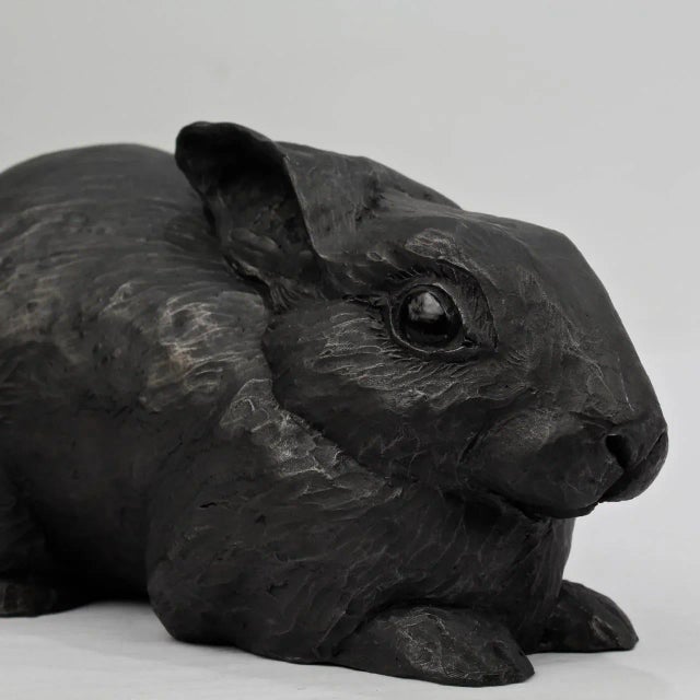 Title: When Bad Things Happen. A unique black painted terracotta sculpture of a rabbit by Darla Jackson. Date: 2014....