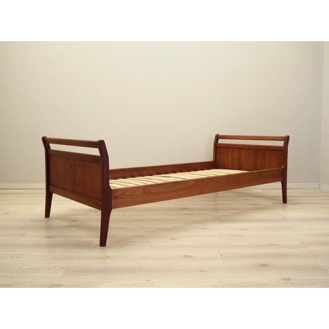 The bed was made in the 1970s, Danish production. The structure is covered with teak veneer. The legs are made of solid...