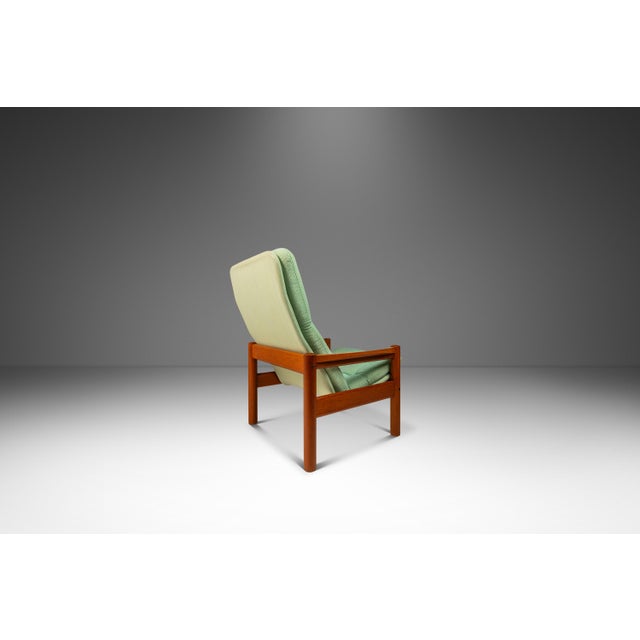 Introducing a Danish-made high-back lounge chair with accompanying foot stool. Crafted in the mid-1970's by the lauded...