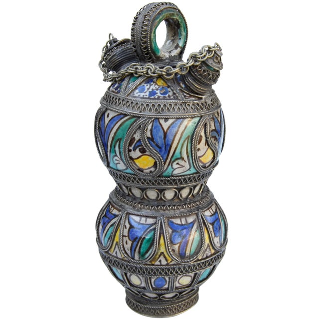 Antique handcrafted and glazed ceramic decorative accent. Features an intricately hand-painted Moorish pattern in a...