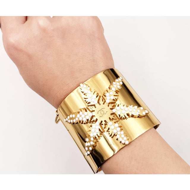Chanel Rare Vintage Gold Plated CC White Bead Snowflake Cuff Bracelet *Marked in 01 *Made in France -It is approximately...