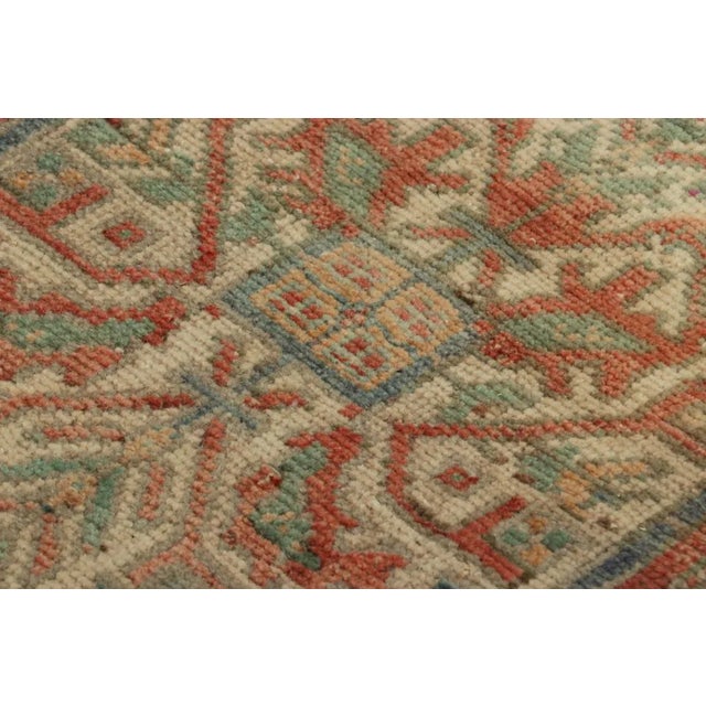 Made with hand-knotted wool, this 1x3 gift-sized vintage Turkish rug originating circa 1950-1960, is from the collection...
