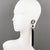 These lovely Paco Rabanne Paris futuristic clip-on earrings feature an oversized shoulder-duster dangling drop shape with...