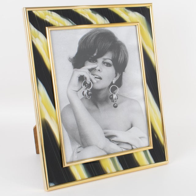 This stunning picture frame was crafted in Italy circa 1970 by designer Montagnani Firenze. The rare photo frame's...