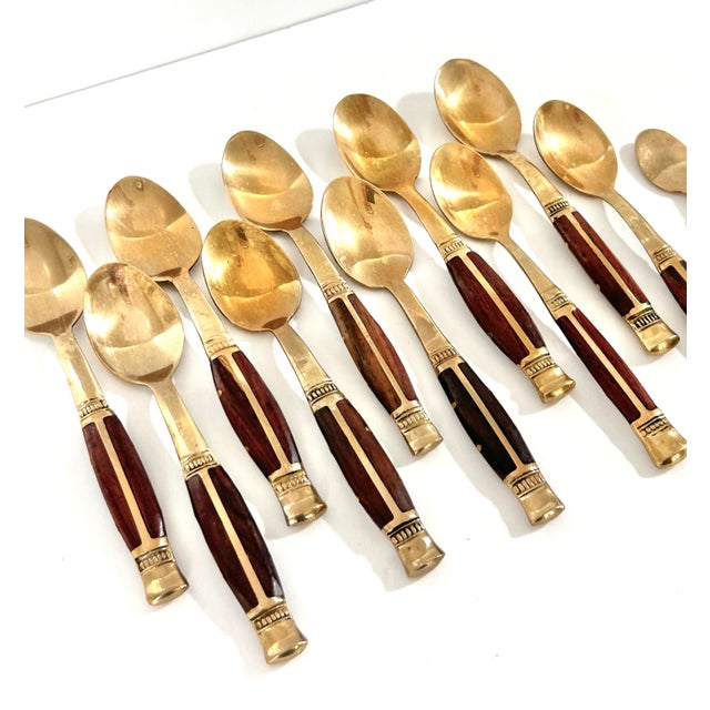 A wonderfully detailed set of hand-forged brass and rosewood Thai demitasse spoons. They are a very handsome set. The...