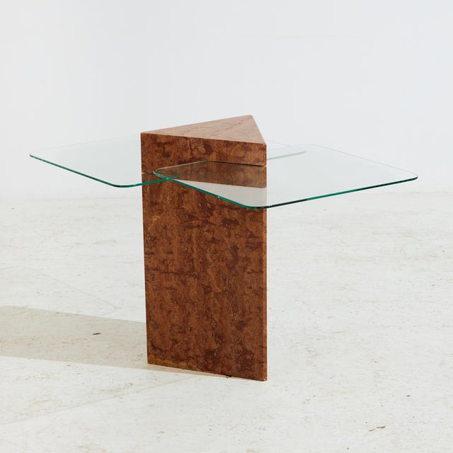 Sculptural marble coffee table with new glass tops from the 1970s. Two glass panels protrude from the marble base of the...